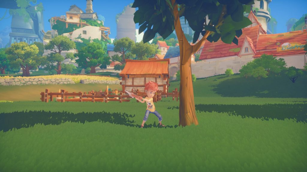 A character in a green landscape beside the town in My Time at Portia.
