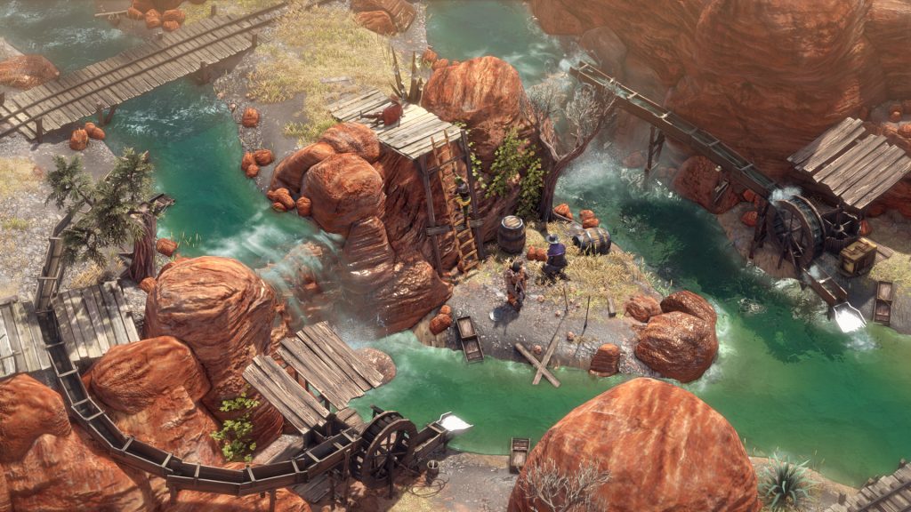 An overhead view of characters beside a river and rocky paths in Desperados III.