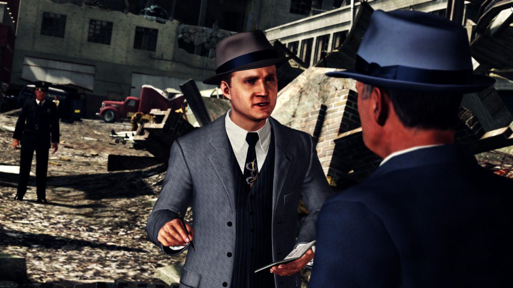 Two men in suits and hats talking in a city street in L.A. Noire.