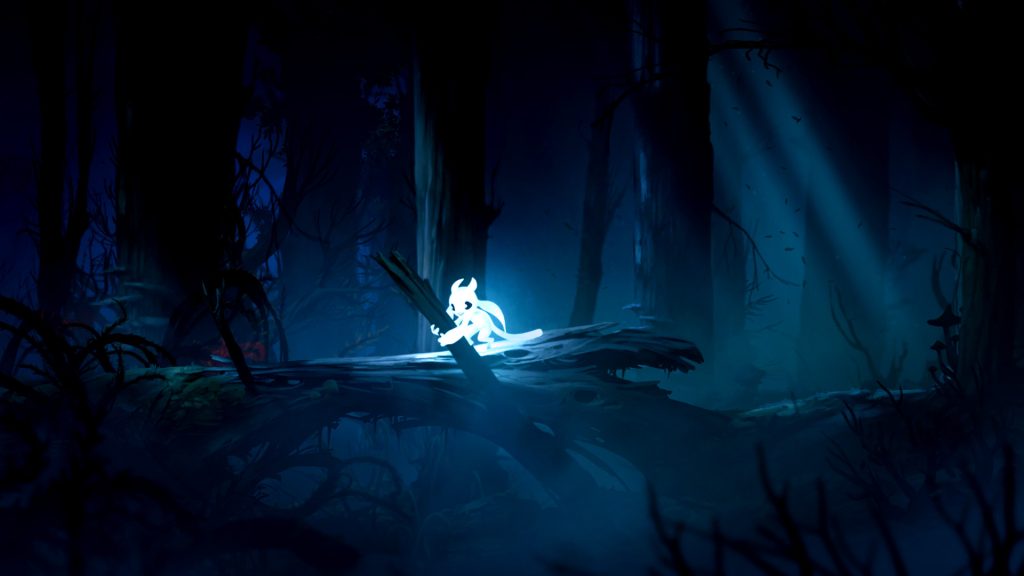 Ori standing on a fallen tree in a blue-lit forest in Ori and the Blind Forest.