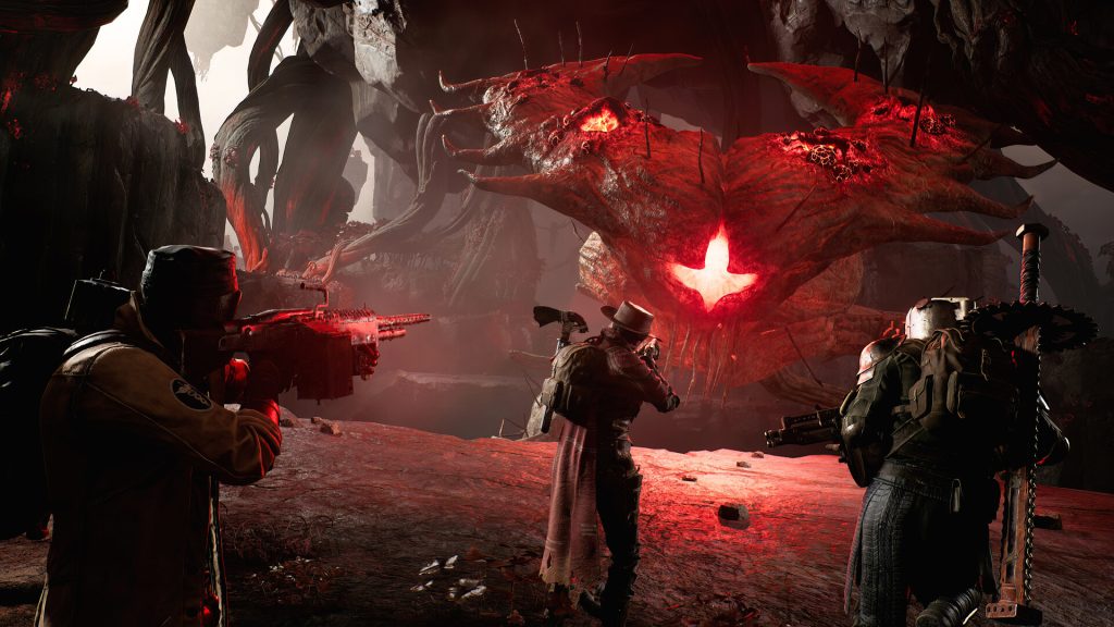 Armed survivors confronting a red-glowing creature in Remnant II.
