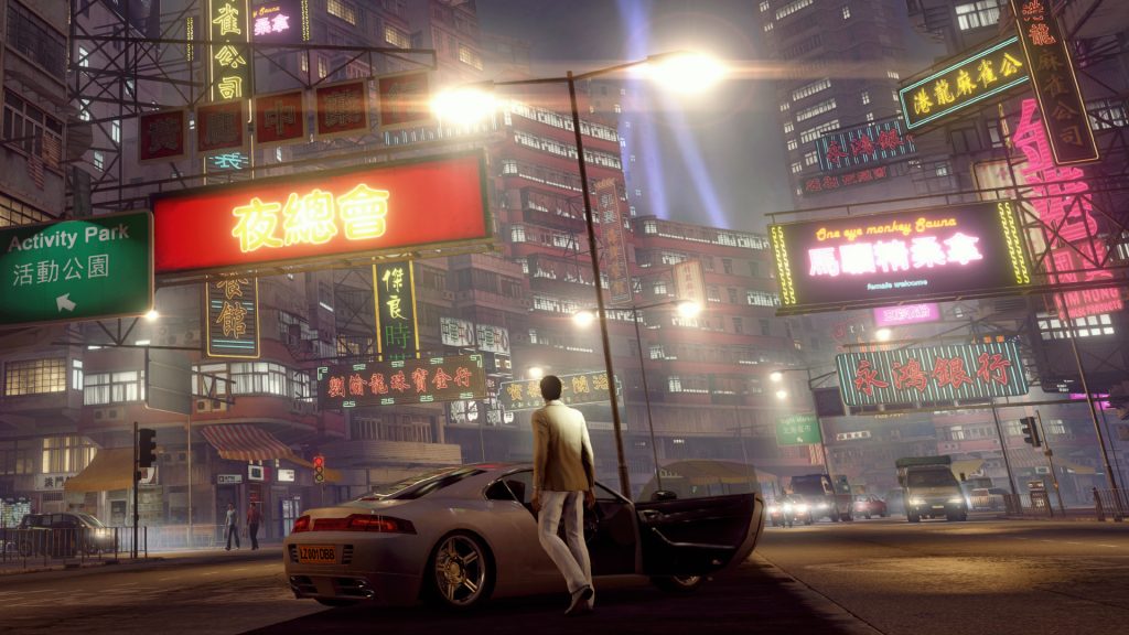 A busy Hong Kong street filled with illuminated signs in Sleeping Dogs: Definitive Edition.