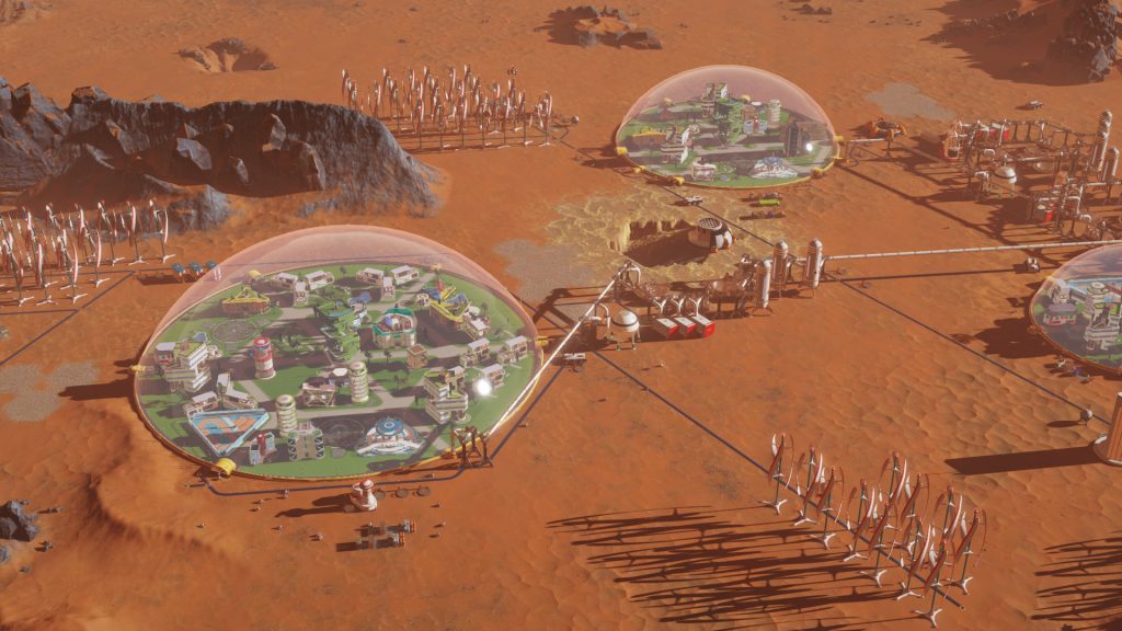 Domed settlements connected across the surface of Mars in Surviving Mars.